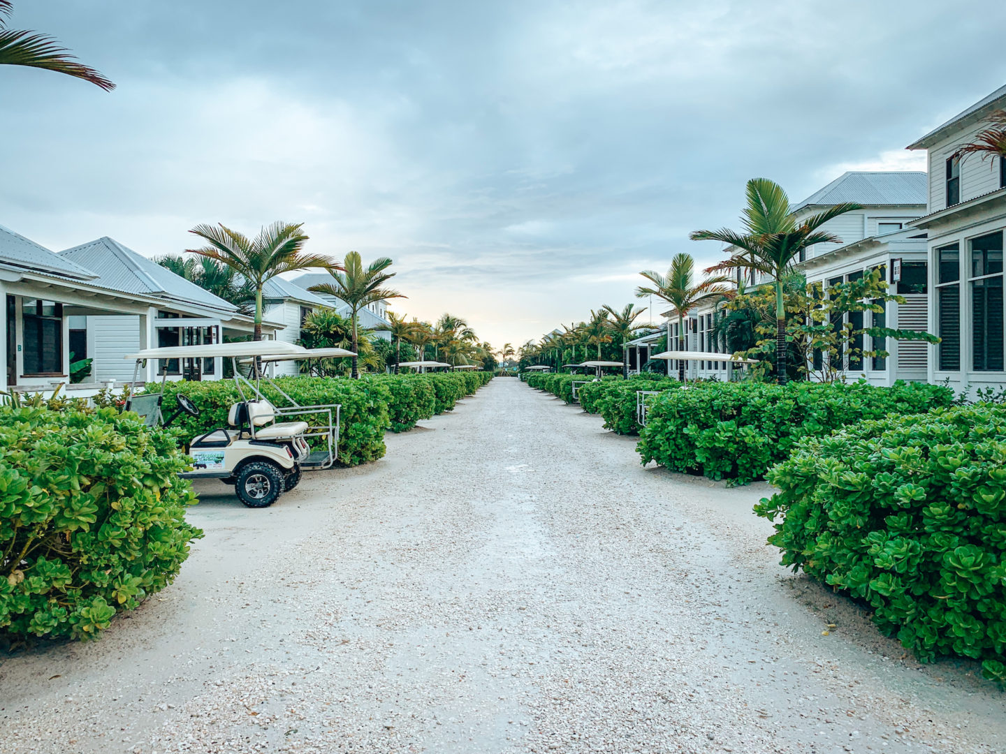 Lane of cottages and golf carts - Mahogany Bay, Belize